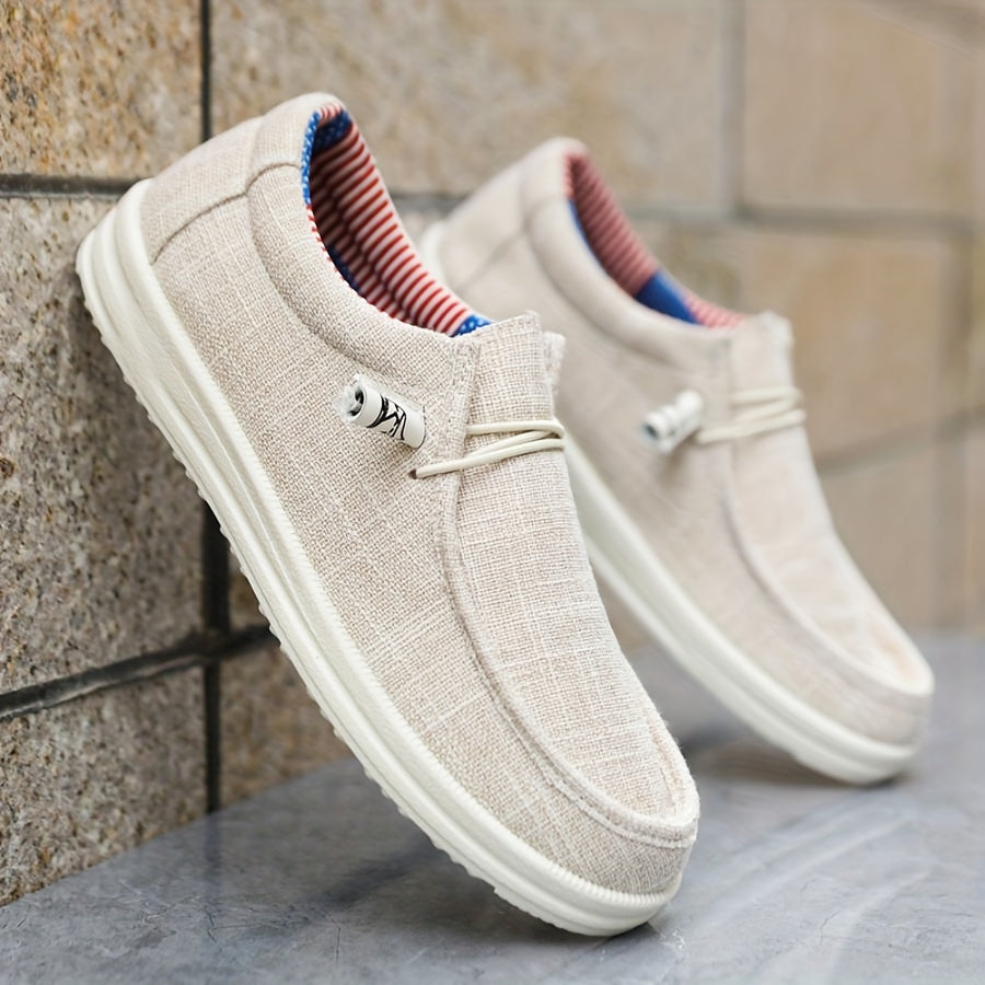 men's slip-on low-top footwear with elastic lace detail and flat sole