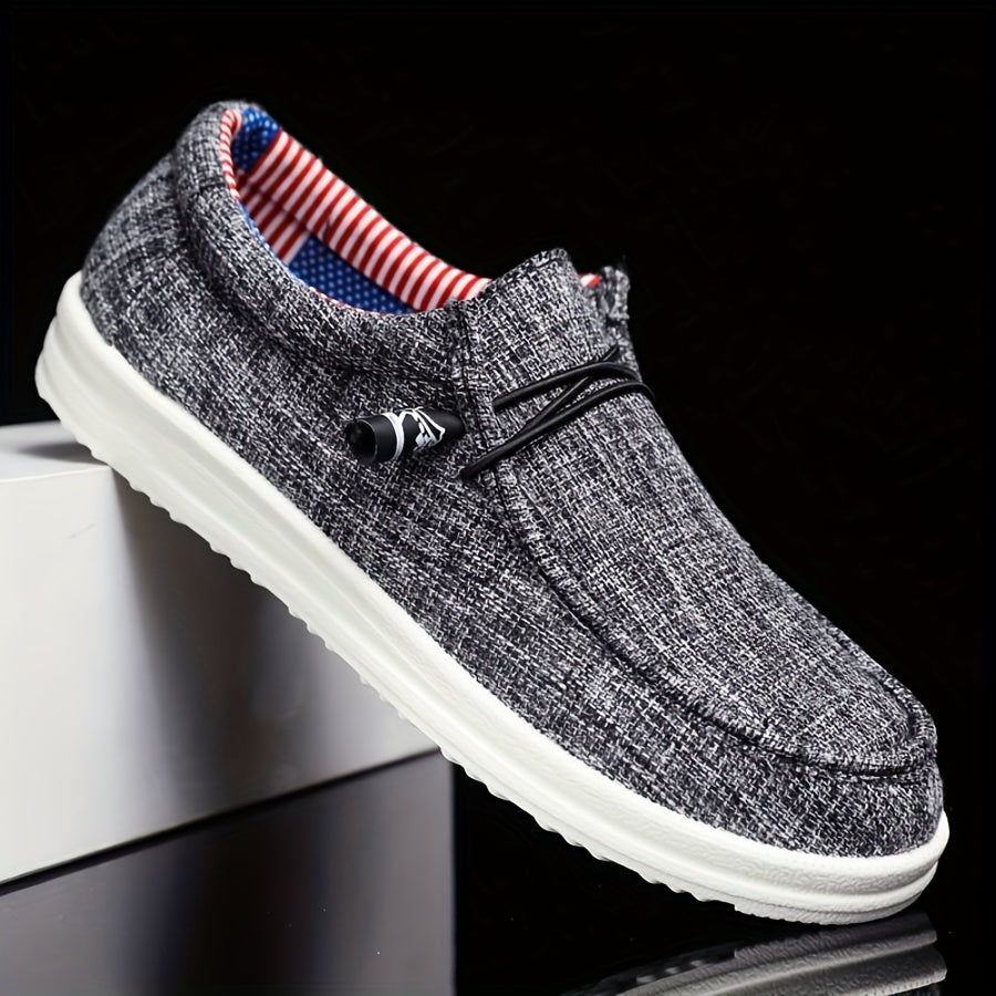 men's slip-on low-top footwear with elastic lace detail and flat sole